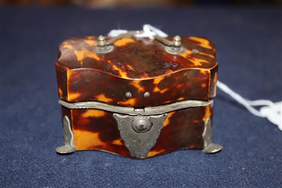 A 19th century white metal mounted tortoiseshell travelling writing set casket and a white metal mounted tortoiseshell box.